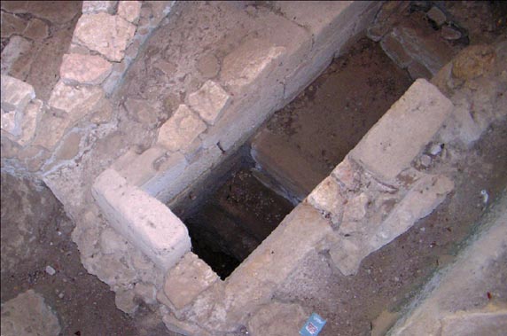 Upper Floor Subterranean Mycenaean Burial Chamber, stone stairs to lower level. Site at Poros - Kefalonia, Greece; Photo by Carolyn Pararas-Carayannis (c)